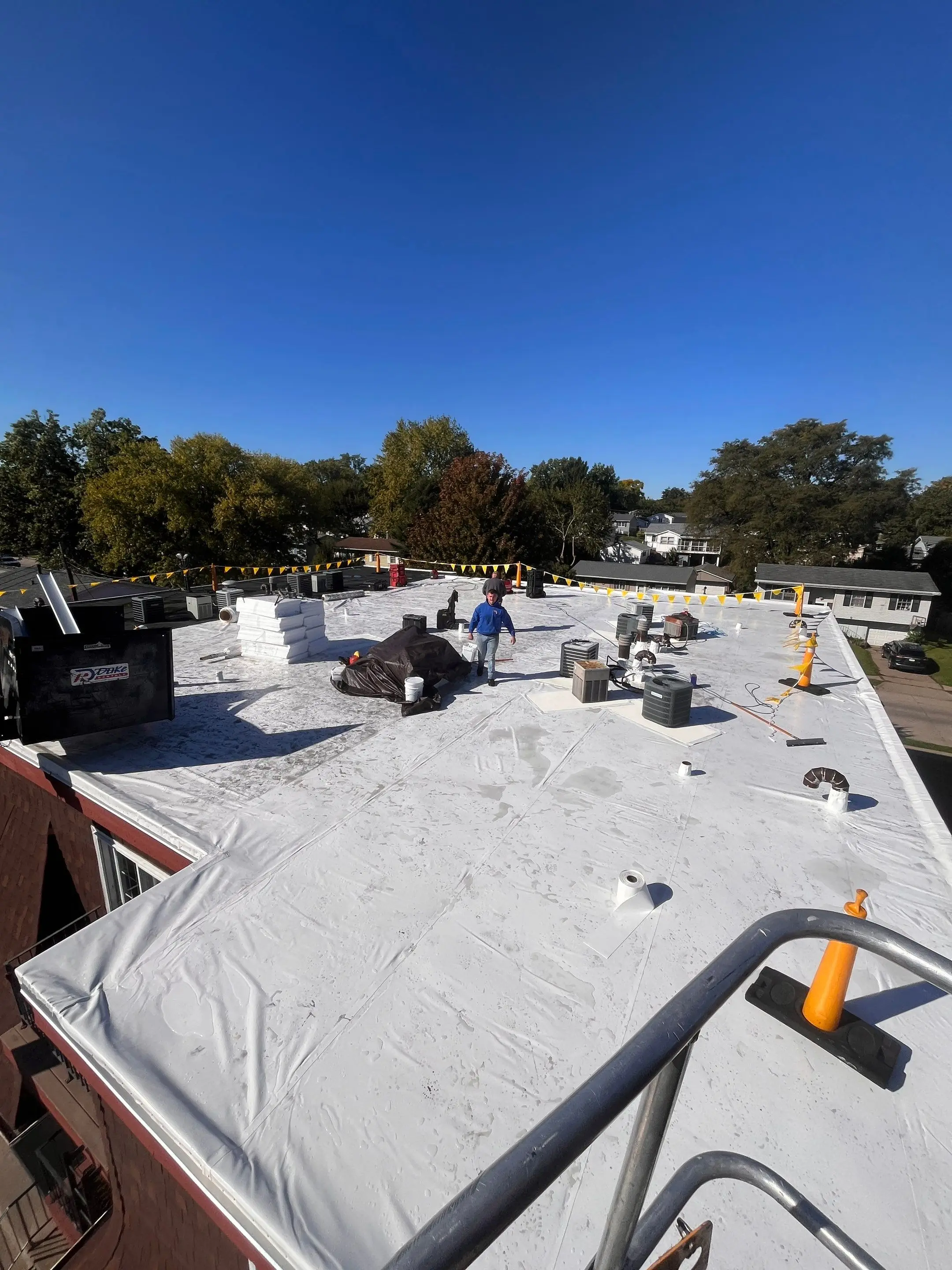 New white Duro-Last roof on a multifamily apartment building in Davenport, Iowa